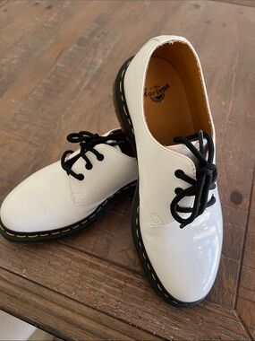 Dr. Martens White Patent Lace-Up Flats with Black Laces